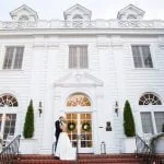 Bride and Groom on the front steps of Duke Mansion
