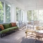 Screened-in Porch with sitting chairs.