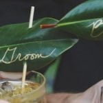 Leaves with Bride & Groom written in gold on them.